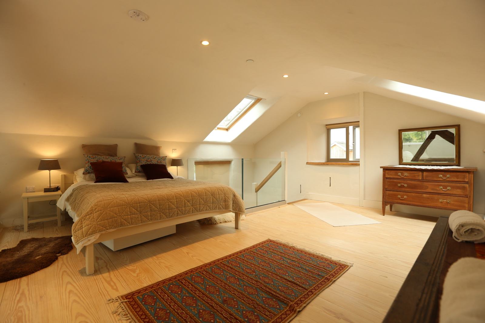 The mezzanine bedroom from the other side, with skylight and chest of drawers